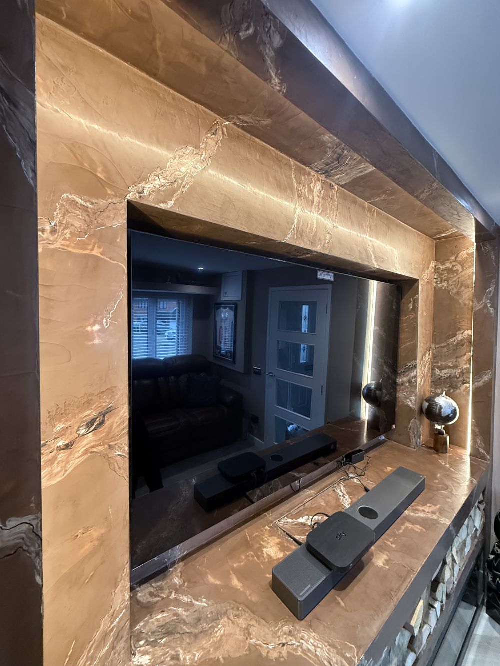 Close-up of copper marble media wall surround