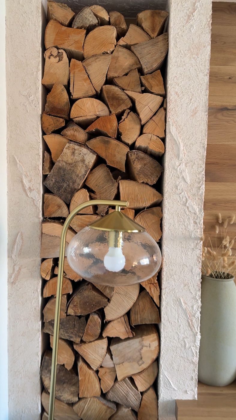 Plaster log store niche beside a media wall