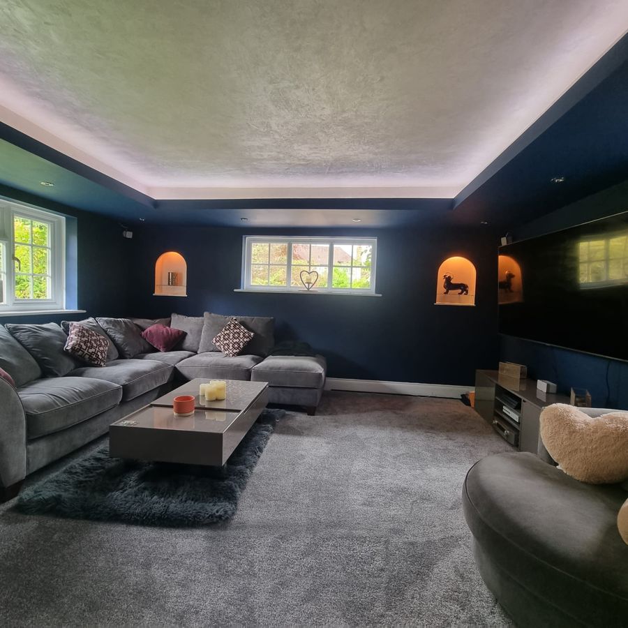Cinema room with polished plaster ceiling and LED lighting